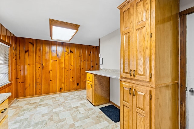 bar with built in desk and wood walls