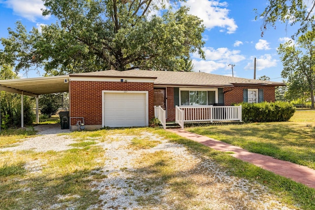 view of front facade with a front lawn, a porch, a carport, and a garage