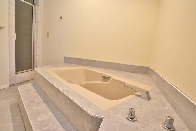 bathroom with shower with separate bathtub