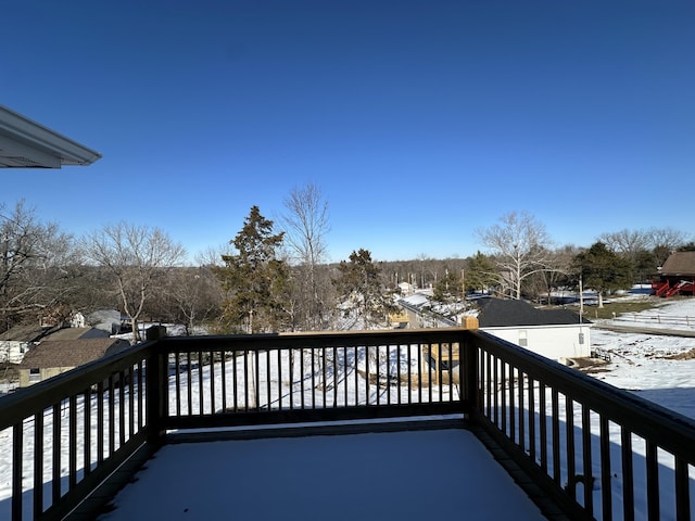 view of snow covered deck