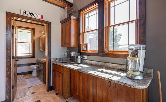 1326 Bald Eagle Dr, Galena, MO 65656 - kitchen with brown cabinets and a sink