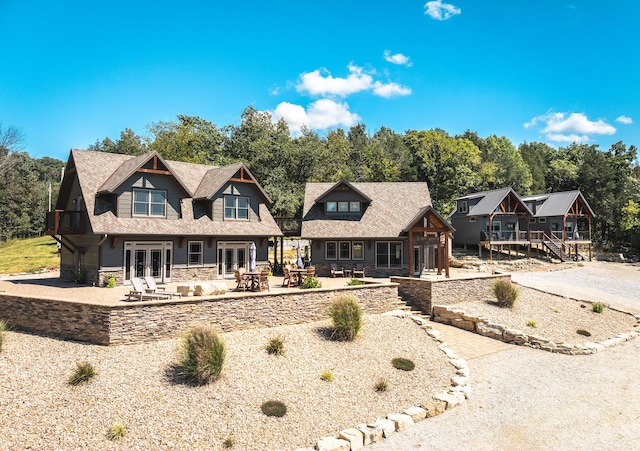 1326 Bald Eagle Dr, Galena, MO 65656 - view of front of property featuring french doors, stone siding, and a patio