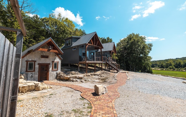 1326 Bald Eagle Dr, Galena, MO 65656 - exterior space with an outdoor structure, stairway, and metal roof