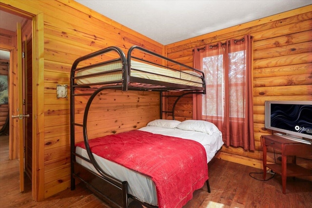 bedroom featuring dark wood-type flooring