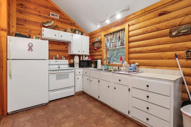 kitchen featuring white appliances, log walls, vaulted ceiling, sink, and white cabinetry