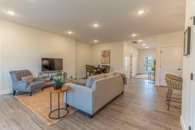 5955 S Farm Rd 163 203B, Springfield, MO 65810 - living area featuring baseboards, visible vents, recessed lighting, and light wood-style floors