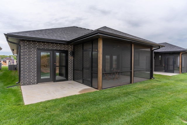 5955 S Farm Rd 163 203B, Springfield, MO 65810 - back of house with brick siding, a yard, a sunroom, and a shingled roof