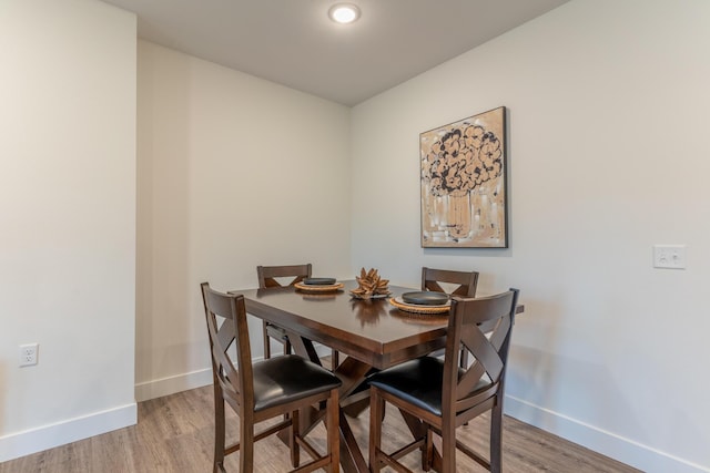 5955 S Farm Rd 163 203B, Springfield, MO 65810 - dining room featuring baseboards and light wood-style floors