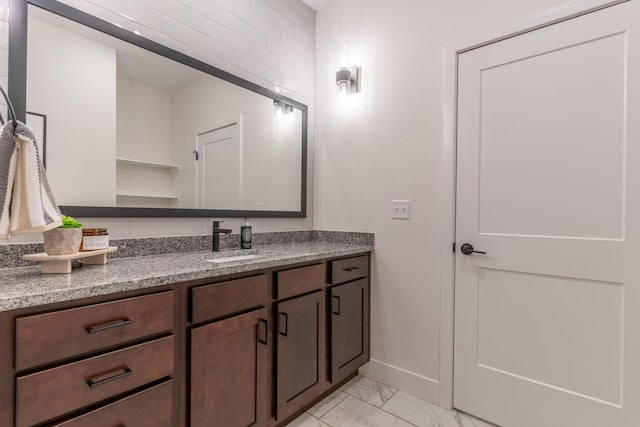 5955 S Farm Rd 163 203B, Springfield, MO 65810 - bathroom featuring marble finish floor, baseboards, and vanity