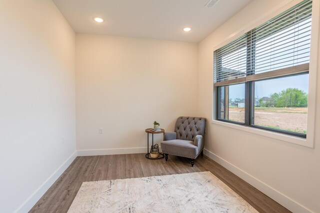 5955 S Farm Rd 163 203B, Springfield, MO 65810 - living area featuring baseboards, wood finished floors, and recessed lighting
