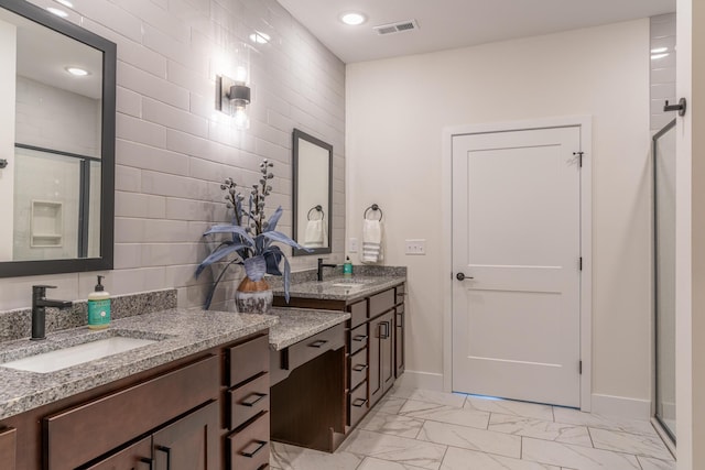 5955 S Farm Rd 163 203B, Springfield, MO 65810 - bathroom featuring a shower stall, marble finish floor, a sink, and visible vents