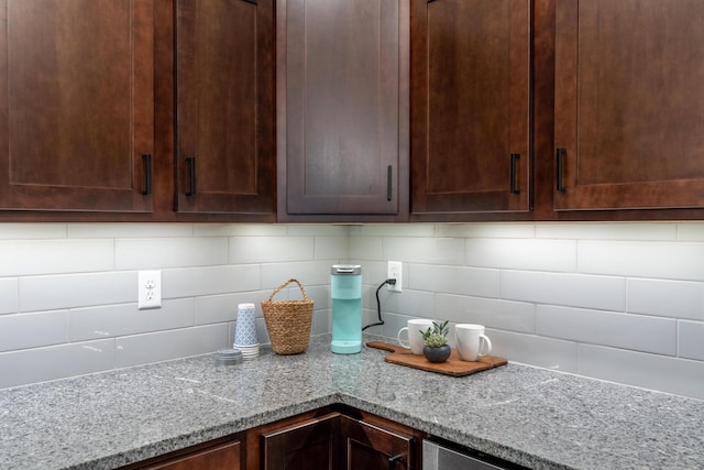 5955 S Farm Rd 163 203B, Springfield, MO 65810 - details with decorative backsplash, dark brown cabinetry, and light stone counters