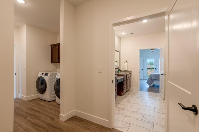 5955 S Farm Rd 163 203B, Springfield, MO 65810 - washroom with marble finish floor, baseboards, washer and clothes dryer, and recessed lighting