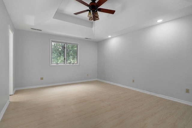 spare room with ceiling fan and light hardwood / wood-style floors