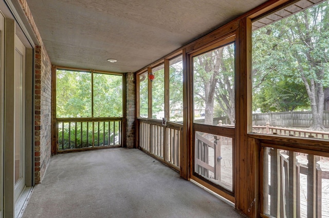 unfurnished sunroom with plenty of natural light