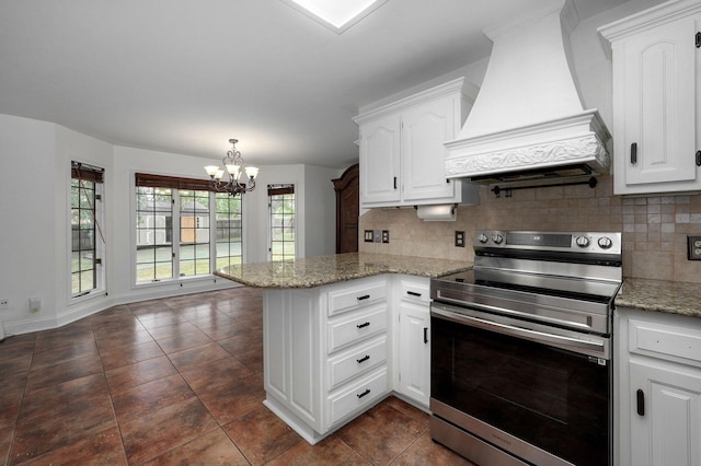 kitchen with a notable chandelier, custom exhaust hood, stainless steel electric range oven, white cabinets, and kitchen peninsula