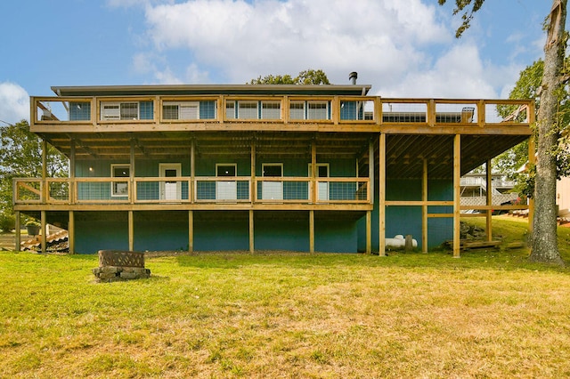 back of property featuring a yard