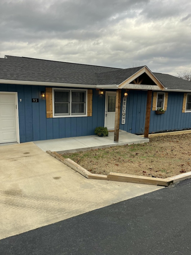 ranch-style house featuring a garage