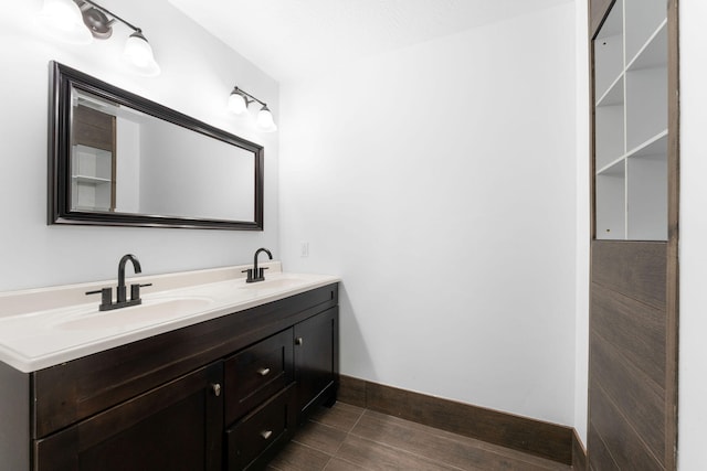 bathroom with vanity and wood-type flooring