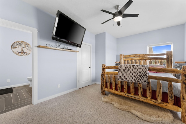 carpeted bedroom featuring ensuite bath and ceiling fan