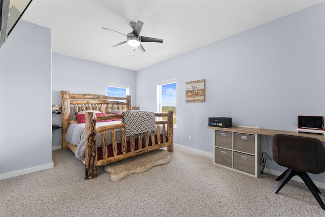 bedroom featuring ceiling fan and light carpet