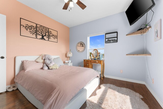 bedroom featuring ceiling fan and dark hardwood / wood-style flooring