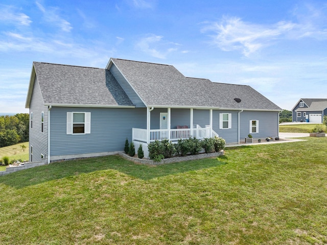 rear view of property with a yard