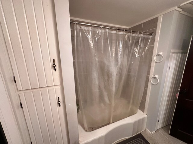 bathroom featuring tile patterned floors and shower / bath combination with curtain