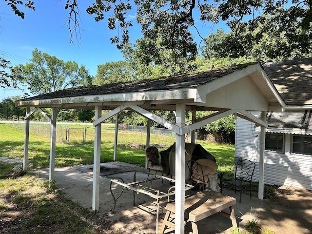 surrounding community featuring a patio, a gazebo, and a lawn