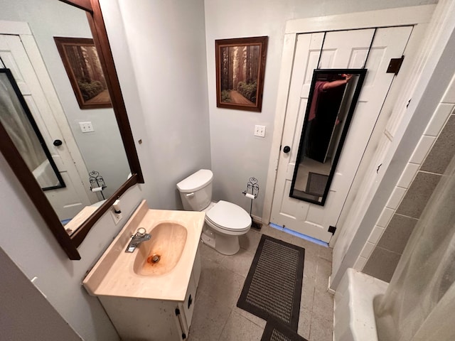 bathroom with vanity, toilet, a shower with curtain, and tile patterned flooring