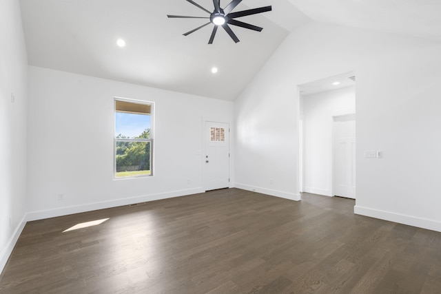 unfurnished room featuring dark hardwood / wood-style floors, ceiling fan, and high vaulted ceiling