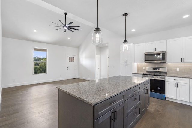 kitchen featuring white cabinetry, dark hardwood / wood-style floors, and appliances with stainless steel finishes