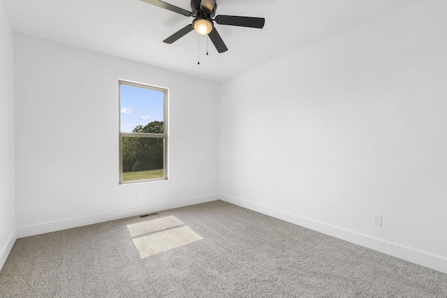 spare room with ceiling fan and carpet floors