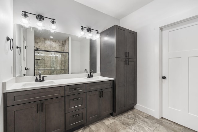 bathroom featuring vanity and an enclosed shower