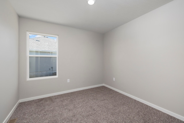 empty room with carpet flooring