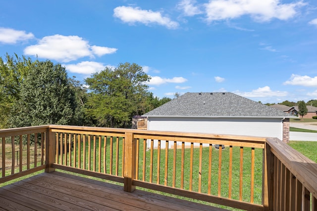 wooden terrace with a lawn