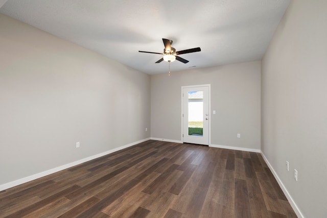 spare room with ceiling fan and dark hardwood / wood-style floors