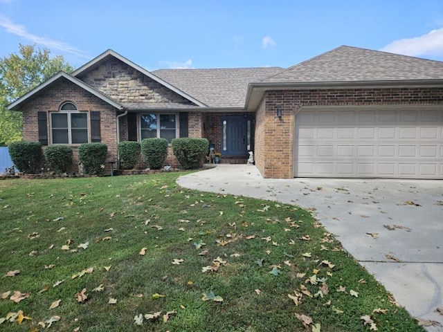 ranch-style home featuring a front lawn and a garage