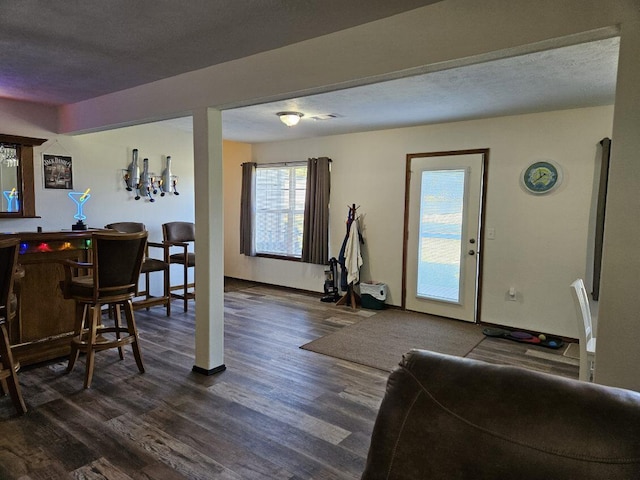 interior space featuring dark hardwood / wood-style floors and a textured ceiling