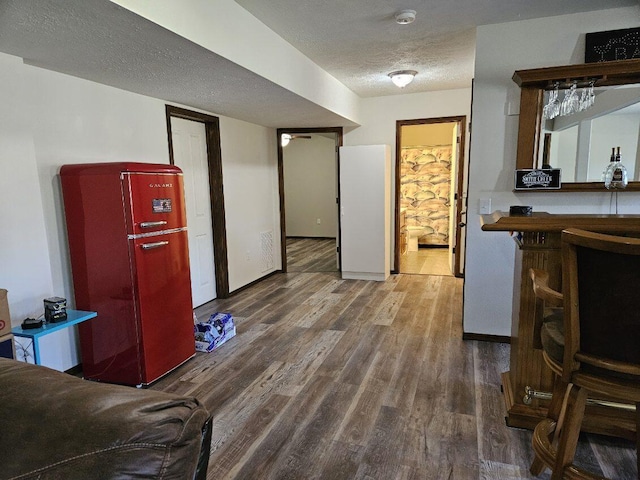 kitchen featuring dark hardwood / wood-style floors and a textured ceiling