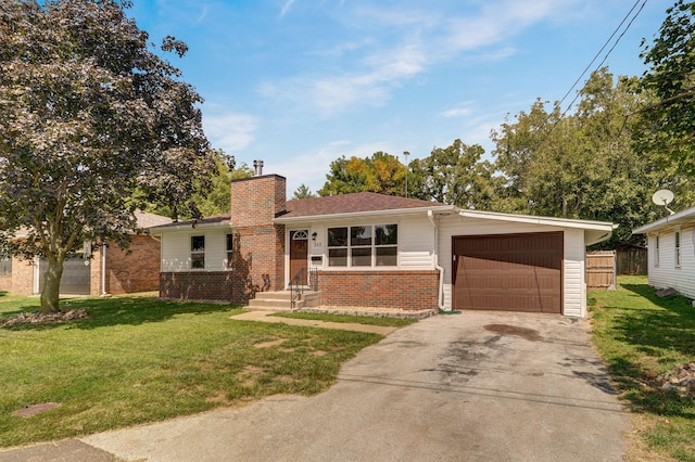 ranch-style house featuring a front yard and a garage