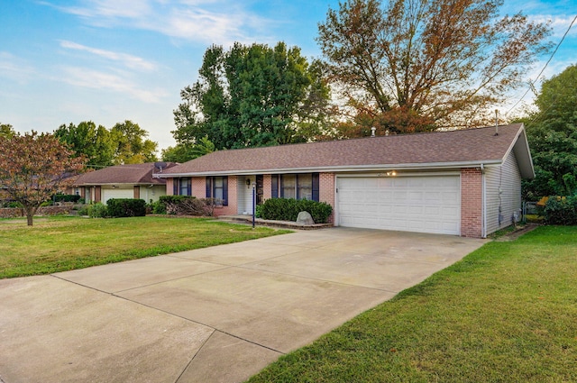 ranch-style house with a garage and a front yard