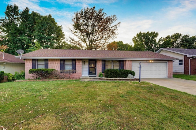 ranch-style home with a garage and a front lawn