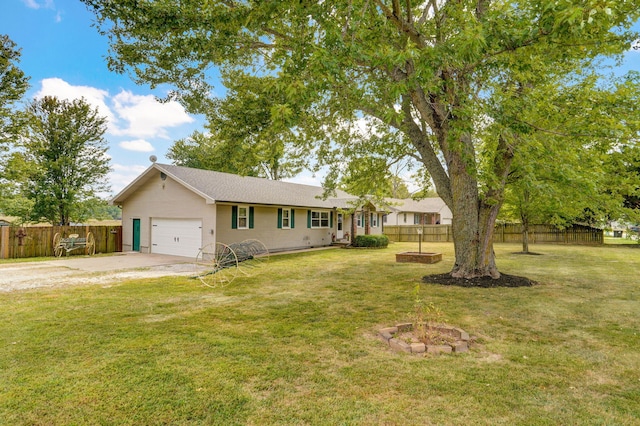 ranch-style home featuring a front lawn and a garage