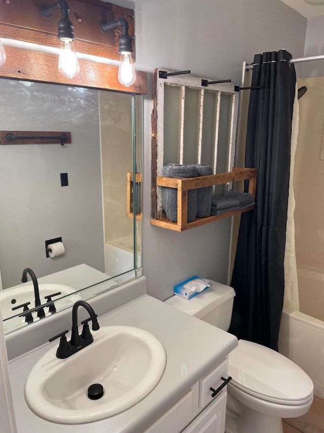 full bathroom featuring shower / bath combination with curtain, vanity, and toilet