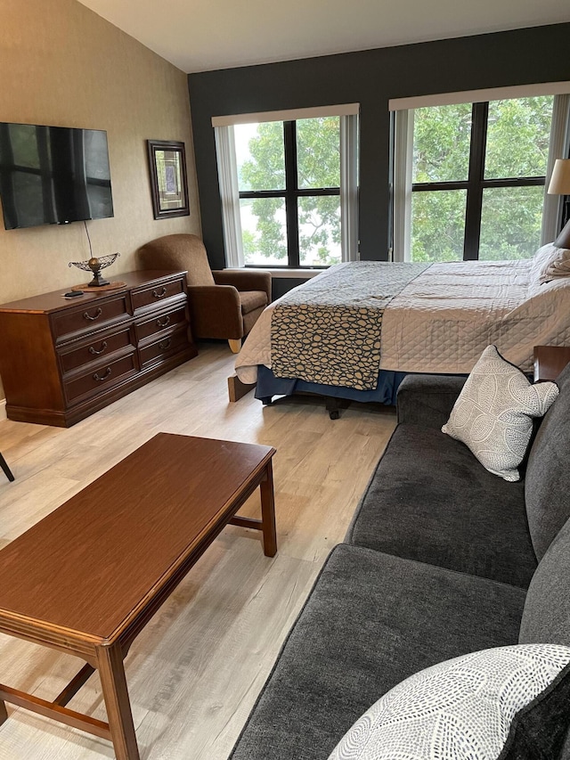 11863 State Highway 13 Unit 160, Kimberling City, MO 65686 - bedroom featuring lofted ceiling and wood finished floors