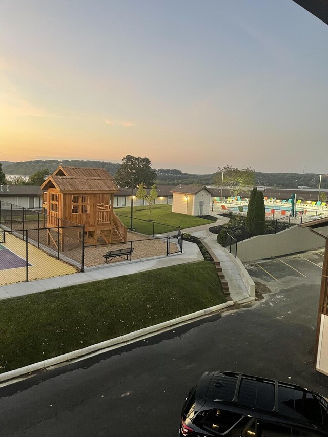 11863 State Highway 13 Unit 160, Kimberling City, MO 65686 - view of community featuring stairway, a lawn, uncovered parking, and fence private yard