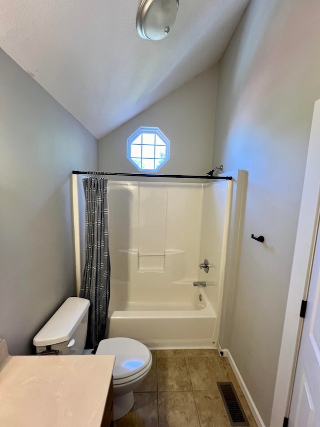 full bathroom featuring lofted ceiling, vanity, tile patterned floors, shower / bath combo, and toilet