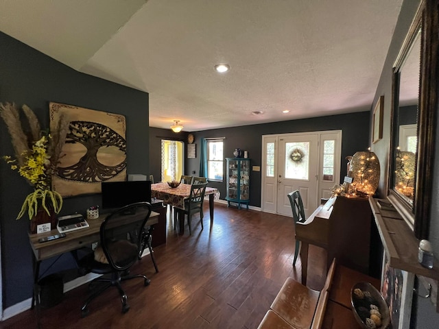 office with a textured ceiling and dark hardwood / wood-style flooring