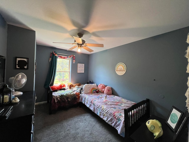 bedroom featuring ceiling fan and dark colored carpet